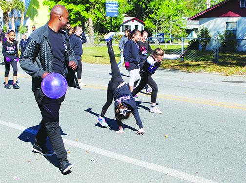 Dancers from USA Gymnastics Academy in Palatka did twirls and cartwheels down Main Street for the parade Saturday morning.