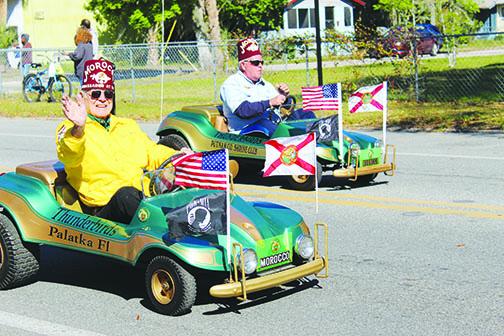 Putnam County Shrine Club members make their way along Main Street on Saturday as the Azalea Parade kicks off the 74th annual Florida Azalea Festival in Palatka.