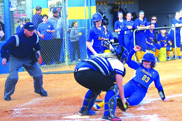 Palatka’s Samantha Clark slides home in the third ahead of the tag by Interlachen catcher Dixie Smith. (MARK BLUMENTHAL / Palatka Daily News)