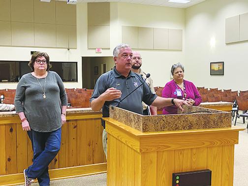 Quin Romay, the chief of Putnam County Emergency Services, and other local officials speak Friday during an emergency Board of County Commissioners meeting.