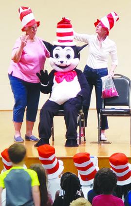 Volunteers read "The Cat in the Hat" to children at Ravine Gardens State Park.