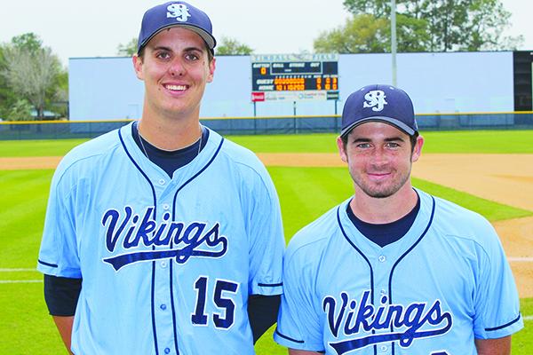 St. Johns River State College baseball pitchers, from left, Brad Torres and Trae Ratliff pose in front of the scoreboard at Tindall Field after combining on a perfect game against Lake-Sumter. (ANDY HALL / Palatka Daily News)