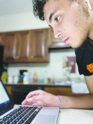 Alex Renta, a Palatka High School junior, participates in the Putnam County School District’s online and home learning program, which began Monday.