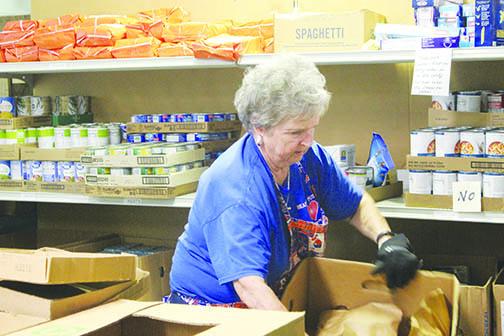Volunteers package food at Heart of Putnam.