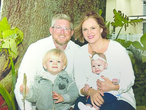 Jeremy Alexander is the new general manager of Beck Chrysler Dodge Jeep Ram in Palatka. Alexander sits with his wife, Crystal, son, Logan, and daughter, Saylor.