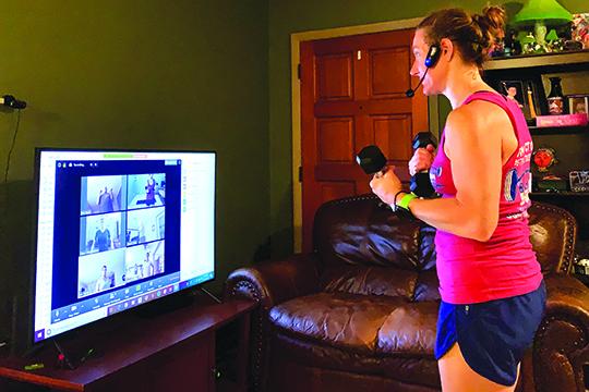 USA Fitness instructor Traci Tidwell does her early workout Thursday with group members online. (Submitted photo)