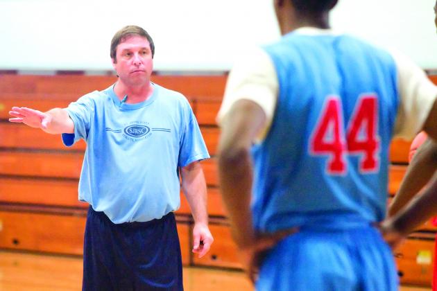 Former St. Johns River State College men’s basketball coach Buster Harvey goes over positioning during a November 2010 practice. (Daily News file photo)