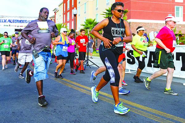 Runners leave the starting line to begin the 2019 Beck 5K in downtown Palatka. (Daily News file photo)