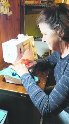A Haven Hospice Roberts Care Center volunteer sews face masks for employees and community partners.