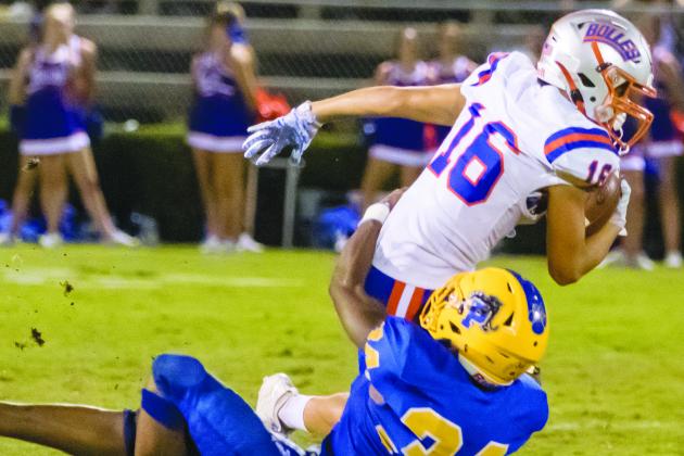 Palatka High School’s David Williams (34) wraps up Jacksonville Bolles School’s Landen Frazier (16) during a game last September. The two schools will face one another at Bolles on Sept. 25. (Daily News file photo)