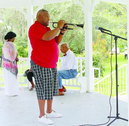 Hartley Leacock plays the trumpet at Eva Lyon Park in Crescent City during a 2017 Juneteenth celebration. The celebration has been canceled this year because of COVID-19.