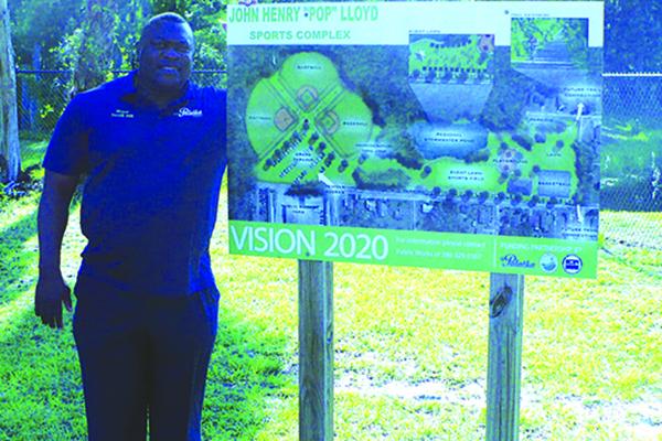Palatka Mayor Terrill Hill shows off the Vision 2020 plan for the John Henry “Pop” Lloyd Sports Complex, set to open up by next year, according to Hill. (MARK BLUMENTHAL / Palatka Daily News)