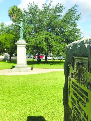 The World War I memorial to Putnam County’s military dead sits in the eastern shadow of the Confederate soldier monument on the Putnam County Courthouse lawn. The historic markers were erected in 1921 and 1924, respectively.