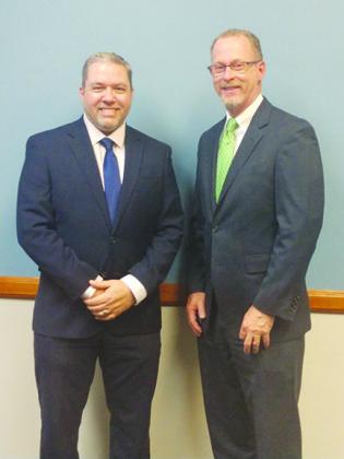 Justin Edwards, left, was recently named president of the International Association of Assessing Officers, Florida Chapter.