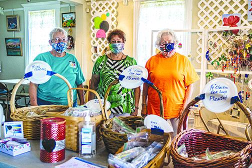 Palatka Art League member Debbie Grabowski, President Deb Daniels and Treasurer Sheri Harnack show the facemasks made for people in the community who need to protect themselves during the coronavirus pandemic.