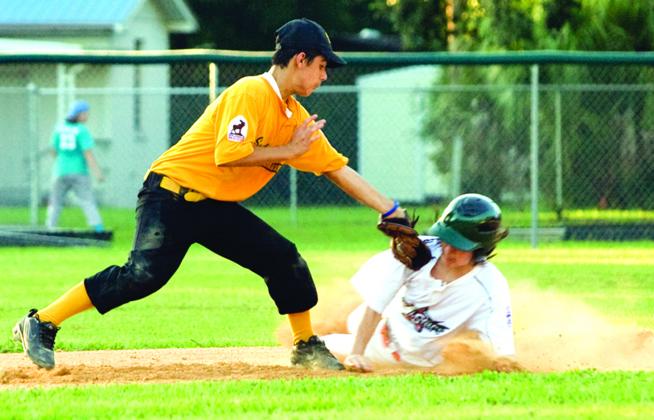 South Putnam’s Andrew Morales tags out Mount Dora’s Gabirel Rodriguez on a steal attempt at second base in the District 19 Junior League All-Star Tournament opener in 2010 in Welaka. (Daily News file photo)