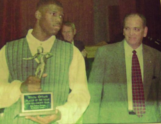 Palatka High’s Willie Offord, who would go on to play at the University of South Carolina and then professionally for the Minnesota Vikings before coaching at many stops, including Interlachen and Palatka, shows off his 1996 player of the year honor next to John Mikell, then president of First Federal of Putnam County. (ANDY HALL / Palatka Daily News)