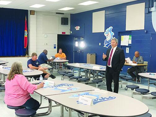 Superintendent Rick Surrency speaks during a Schools Reopening Task Force meeting last month as Mark Motl, center, looks on. Motl is president of the Putnam Federation of Teachers/United.