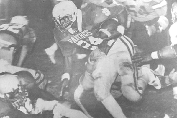 Palatka High School’s Jimmy O’Neal goes for yards in the team’s state tournament opening-round victory at home against Jacksonville Lee in 1982. (Daily News file photo)