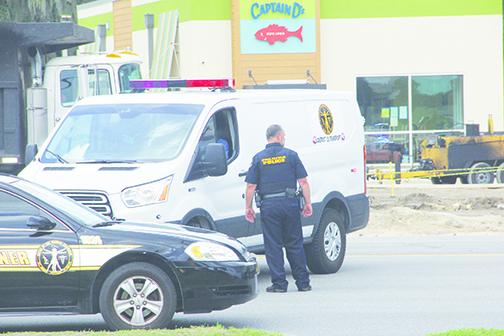 Authorities respond to the scene along State Road 19 in Palatka on Tuesday morning after a vehicle fatally struck a subcontractor for Captain D’s.
