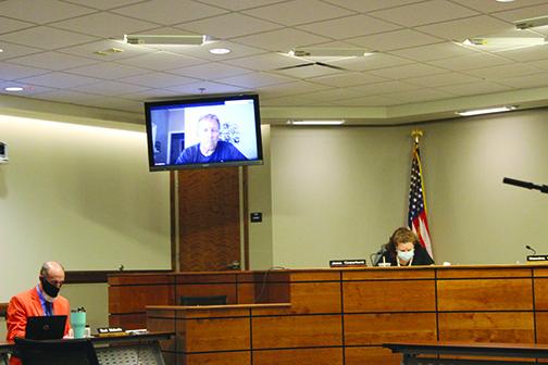 Superintendent Rick Surrency attends Monday's school board meeting virtually after being diagnosed with COVID-19.
