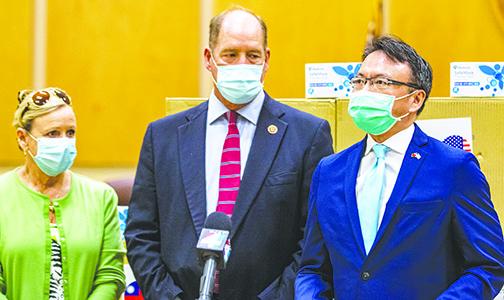 David Chien, right, general director of the Taipei Economic and Cultural Office in Miami, says Wednesday how happy he is to help Putnam County fight the coronavirus pandemic with the donation of 10,000 masks. Chen stands with U.S. Rep. Ted Yoho, R-Fla., and his wife, Carolyn Yoho.