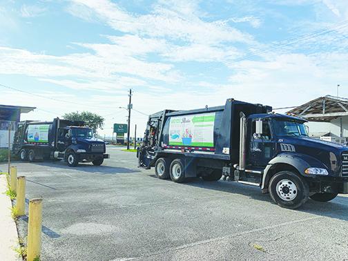 Palatka sanitation trucks are parked outside City Hall on Monday morning.