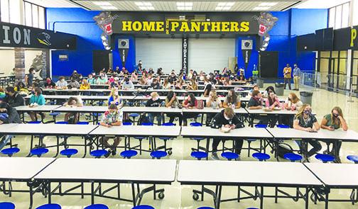 Palatka High School students social distance while eating lunch on the first day of school Monday. Putnam County School District officials have put in extra effort to ensure students and staff remain safe in school amid the coronavirus pandemic.