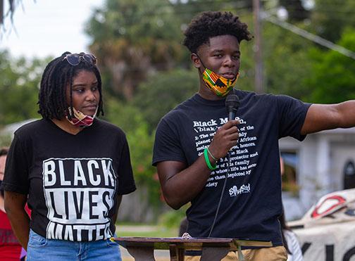 Protest organizers Dar'Nesha Leonard and Tevel Adams remind supporters Saturday why they are advocating for the removal of the Confederate monument from the grounds of the Putnam County Courthouse..