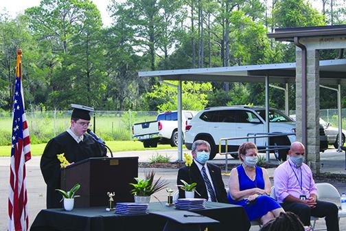 Ansley Hall delivers the keynote speech during E.H. Miller’s graduation ceremony Thursday morning honoring the school’s 12 graduates.