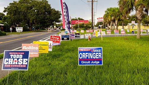 Campaign signs line Crill Avenue on Friday in front of the Supervisor of Elections Office at the Putnam County Government Complex.