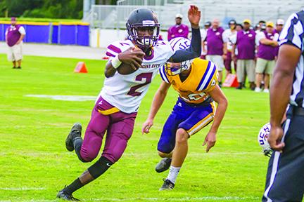 Crescent City senior Naykee Scott (2) keeps the ball and rambles across the goal line in the first quarter for the Raiders second score in a preseason game against Union County last August. 
