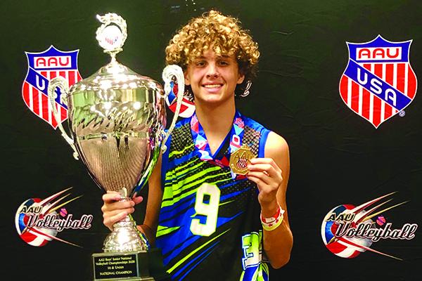 Luke Lewandowski shows off a pair of honors he and his team earned during their time at the AAU 16-and-under National Championships recently. (Submitted photo)