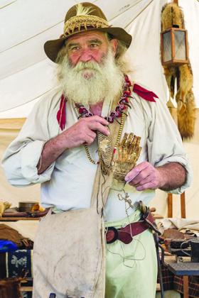 Robert Wilson as trader Job Wiggens shows off his bear claw at the Bartram Frolic last year.