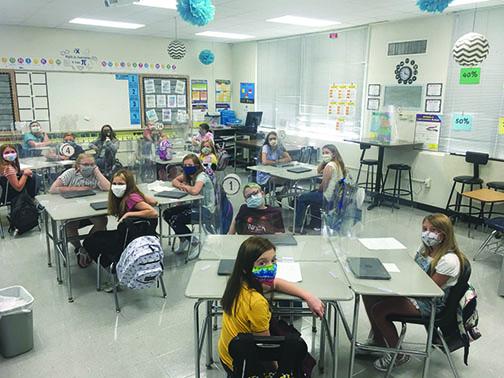 CL Overturf Jr. Sixth Grade Center students adjust to classrooms with plastic dividers in addition to wearing masks.