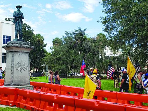 Counterprotesters against the relocation of the Confederate monument gather around barricades surrounding the statue at the Putnam County Courthouse on Aug. 8.