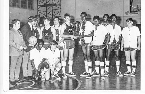 Players from the 1969-1970 Palatka South High School basketball team show off a trophy.