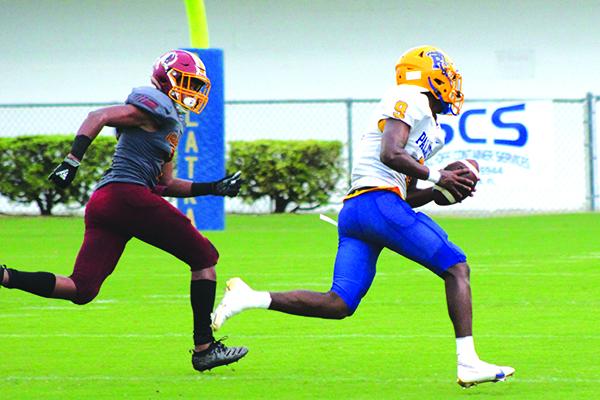 Palatka High School quarterback Omarrion Wilson takes off with the ball on a first-quarter run of 27 yards during last Friday night’s opener against West Nassau High. (ANDY HALL / Palatka Daily News)