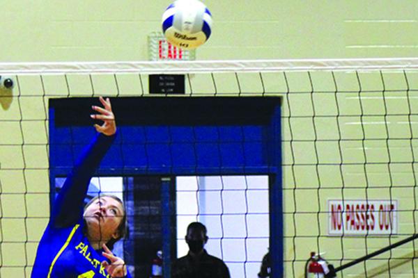 Palatka’s Kayla Burwell goes high to deliver a kill attempt against Hawthorne during Saturday’s play at Palatka High School. (MARK BLUMENTHAL / Palatka Daily News)
