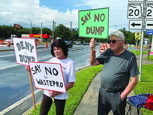 Sue Paper, left, and Lynn Dawson protest a potential landfill in Interlachen.