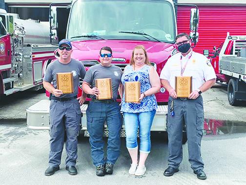 Putnam County Fire Rescue Emergency Medical Services employees Jeff Guthrie, Nat Gill, Nikki Glance and Interim Putnam County Fire Chief Paul Flateau are recognized last week for 20 or more years of service in Putnam.
