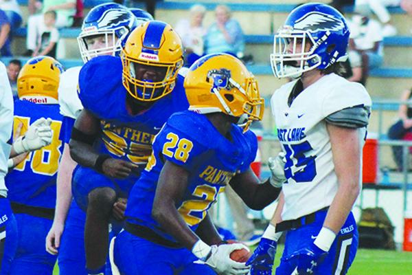 Palatka High’s Kriston Mack (28) celebrates a first-quarter fumble recovery Friday night at home against Tarpon Springs East Lake High. (ANDY HALL / Palatka Daily News)
