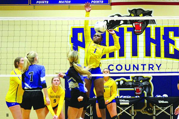 Palatka’s Khi’ya Lookadoo (1) goes high to block the shot of Peniel Baptist Academy’s Brook Williams for a Panthers point in Palatka’s four-set victory over the Warriors on Tuesday. (MARK BLUMENTHAL / Palatka Daily News)
