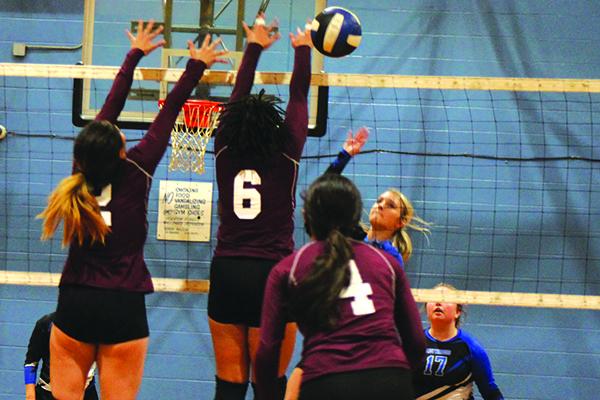 Peniel Baptist Academy’s Brook Williams (right) puts a kill down beyond Crescent City’s Veronica Ramirez (2) and Jordan Williams (6) during Thursday’s match at Jenkins Middle School. (MARK BLUMENTHAL / Palatka Daily News)