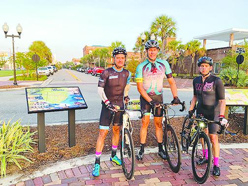 Bicyclists on the 200-mile Sea-2-Key race enjoy the sunrise Saturday as they pass through Palatka on their way to Cedar Key.