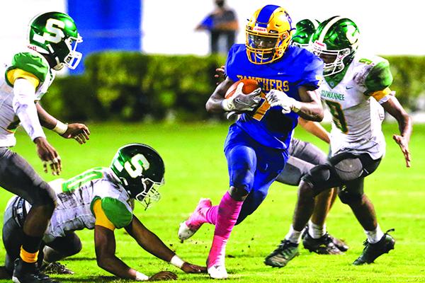 Delton Nealy lugs the ball for yardage during Palatka High’s loss on Oct. 9 to Live Oak Suwannee. The 0-8 Panthers travel to 0-7 Middleburg for a game on Friday night. (GREG OYSTER / Special To The Daily News)