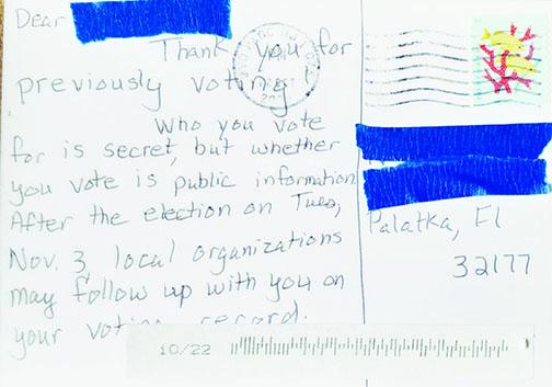 A Palatka woman received this message on an Indivisible Chicago Alliance postcard she said is targeting voters.