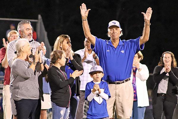 Former Interlachen High School athletic director and football coach Doug Feltner acknowledges the crowd after the field is named in his honor at IHS. (EVALENA DAVIS / Special To The Daily News)