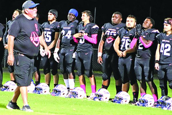 Interlachen High interim football coach Ron Whitehurst talks to his players before the game. (EVALENA DAVIS / Special To The Daily News)