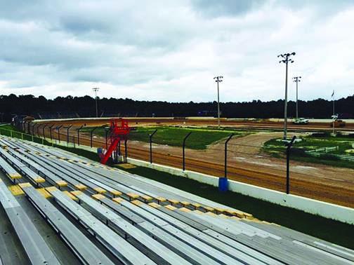 A view from the grandstands as trucks spread new clay recently at the Putnam County Speedway, which is under new ownership.
